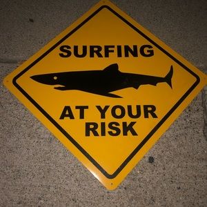 Surf at your own risk sign